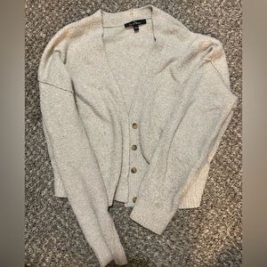 Fuzzy cardigan with buttons.